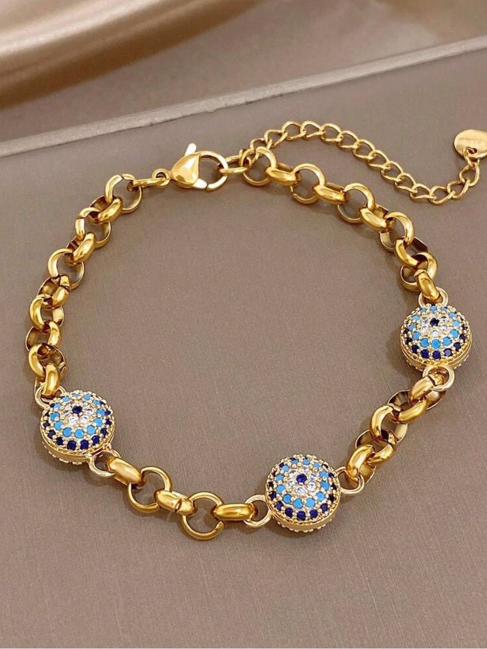 Gold-Tone Bracelet with Blue and White Pave Discs
